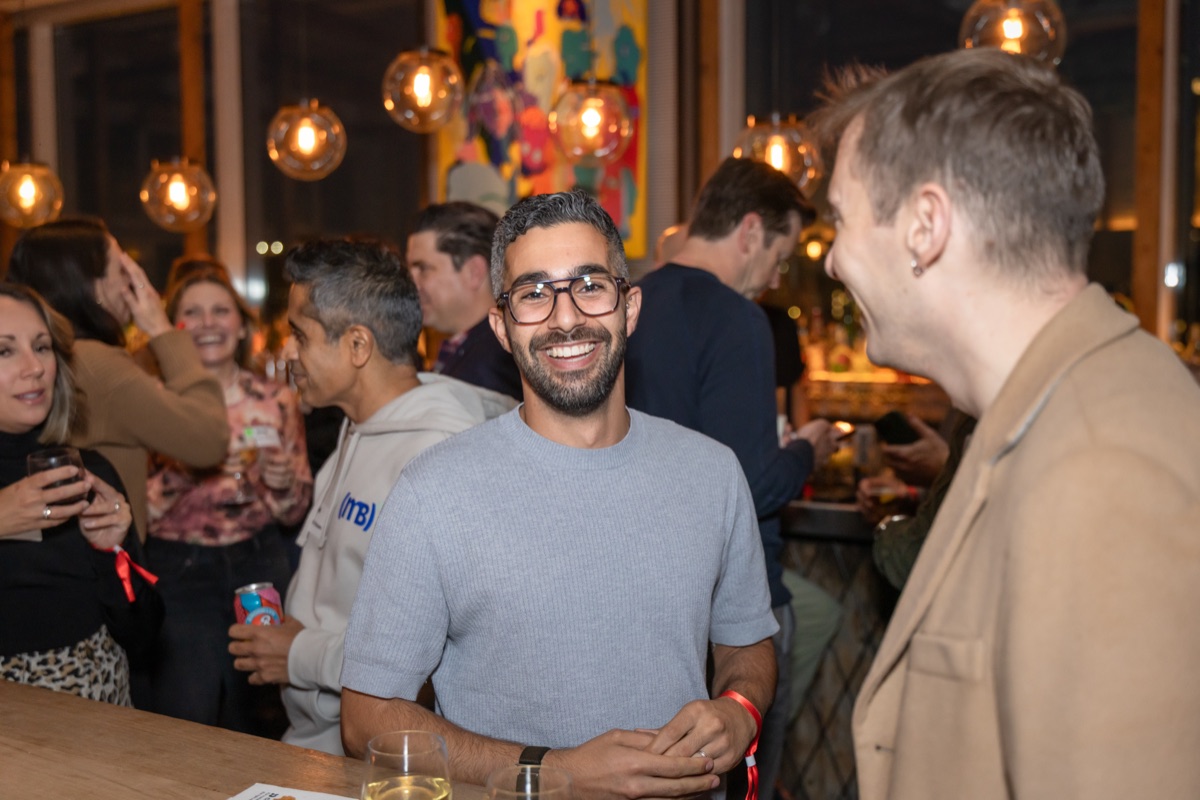 A guest smiling during a conversation.