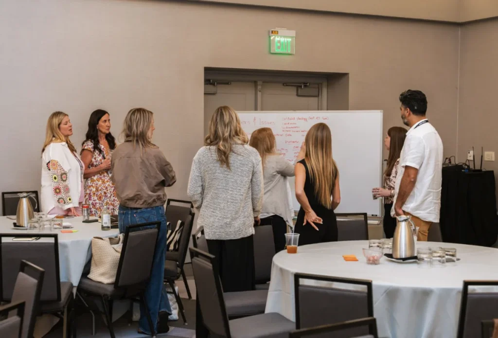 CMO Council members connecting at an in-person event